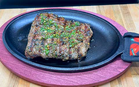 Churrasco con Chimichurri - Thick flap meat steak with chimichurri sauce Cuban style